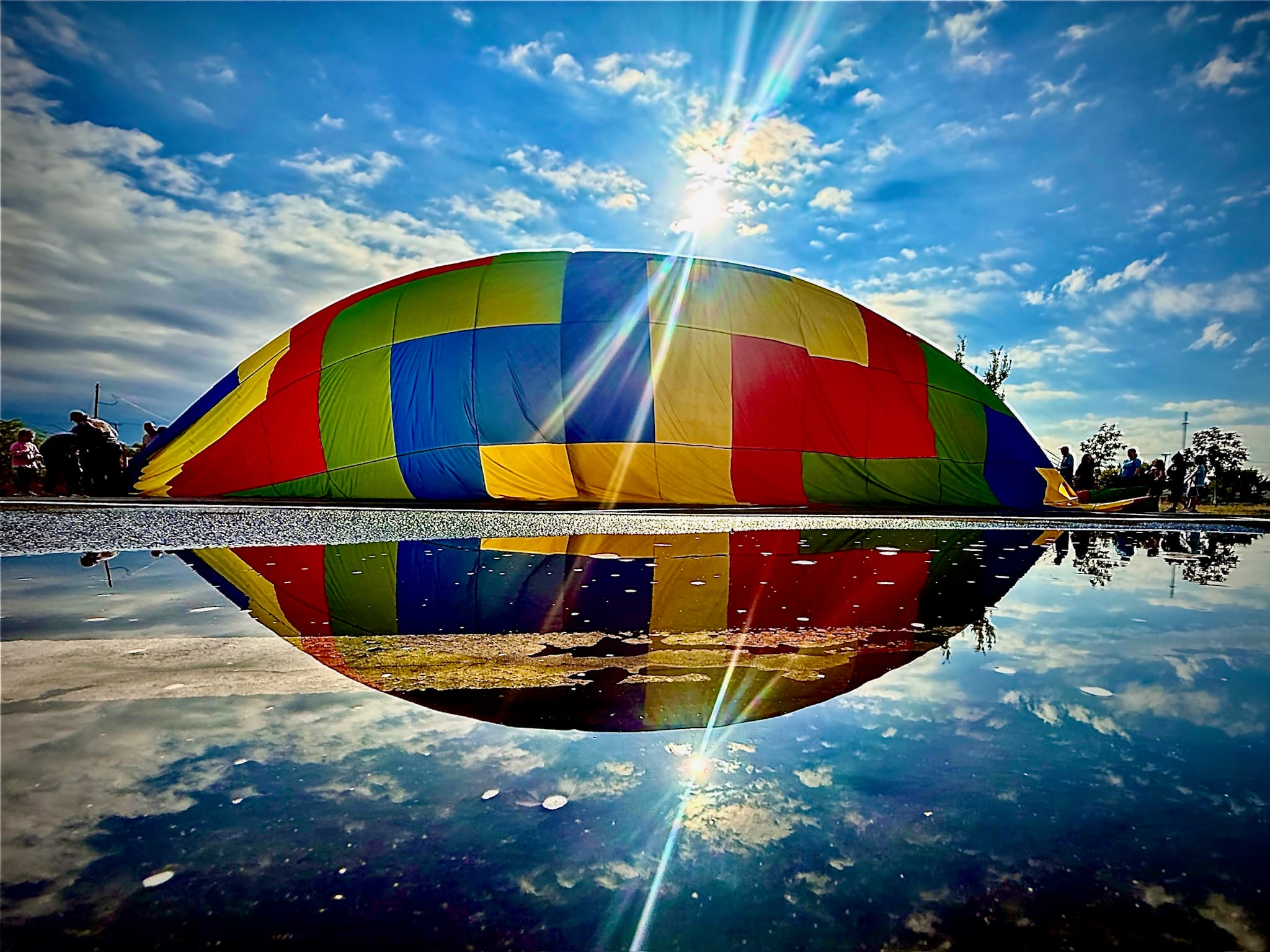 A photographer shooting a balloon from the launch field